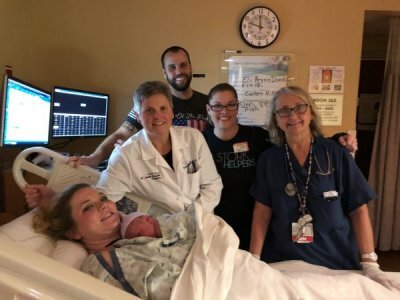 nurses, Tamara, spouse, and mom holding baby